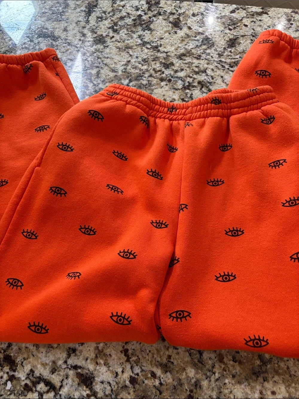 Adika Women’s Bright Orange Eye-Print Crewneck Hoodie and Pants set